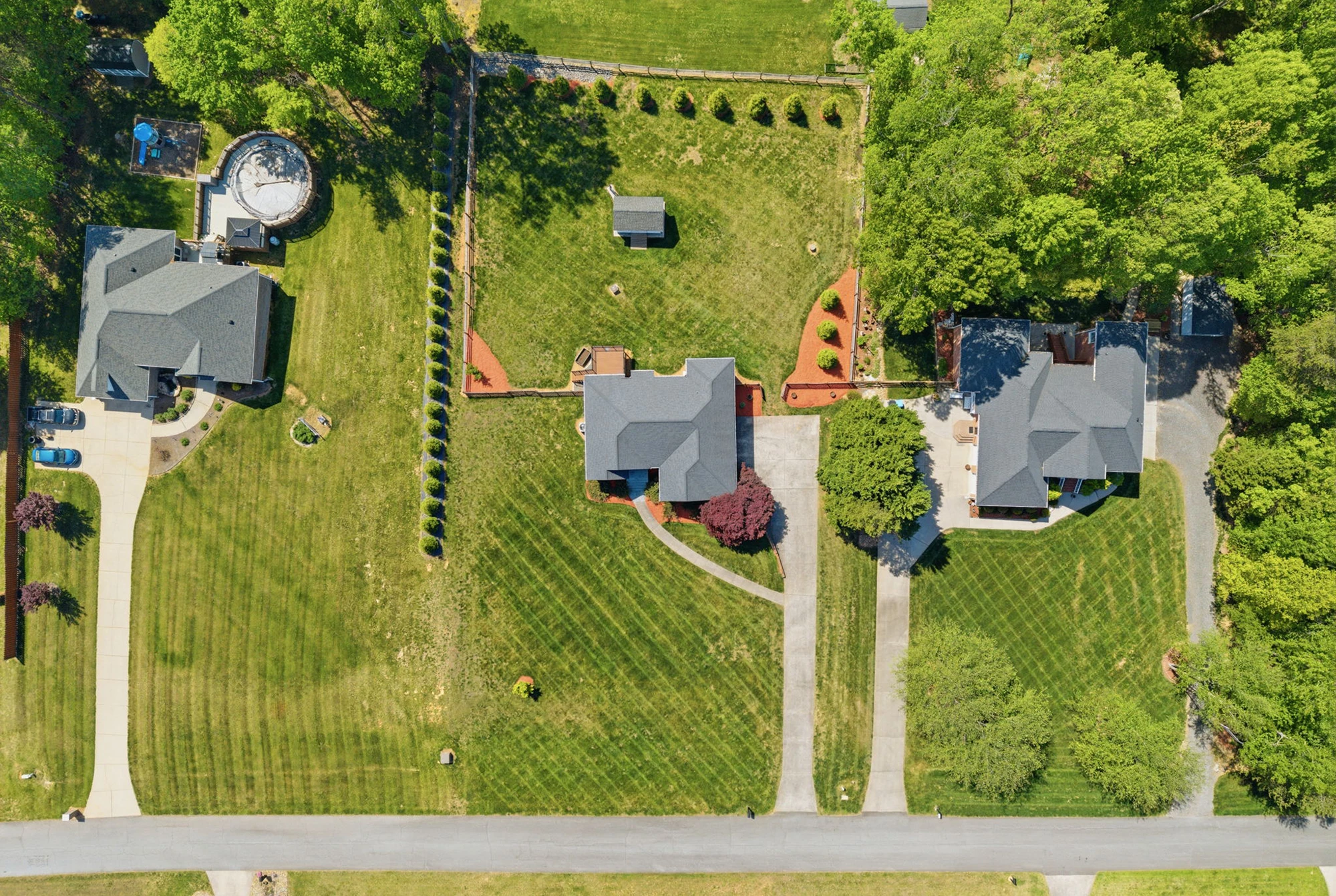 Top-down aerial drone photo of residential properties in Clemmons NC showcasing overhead real estate drone photography service